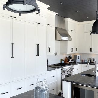 Spacious kitchen with grey and white tones.